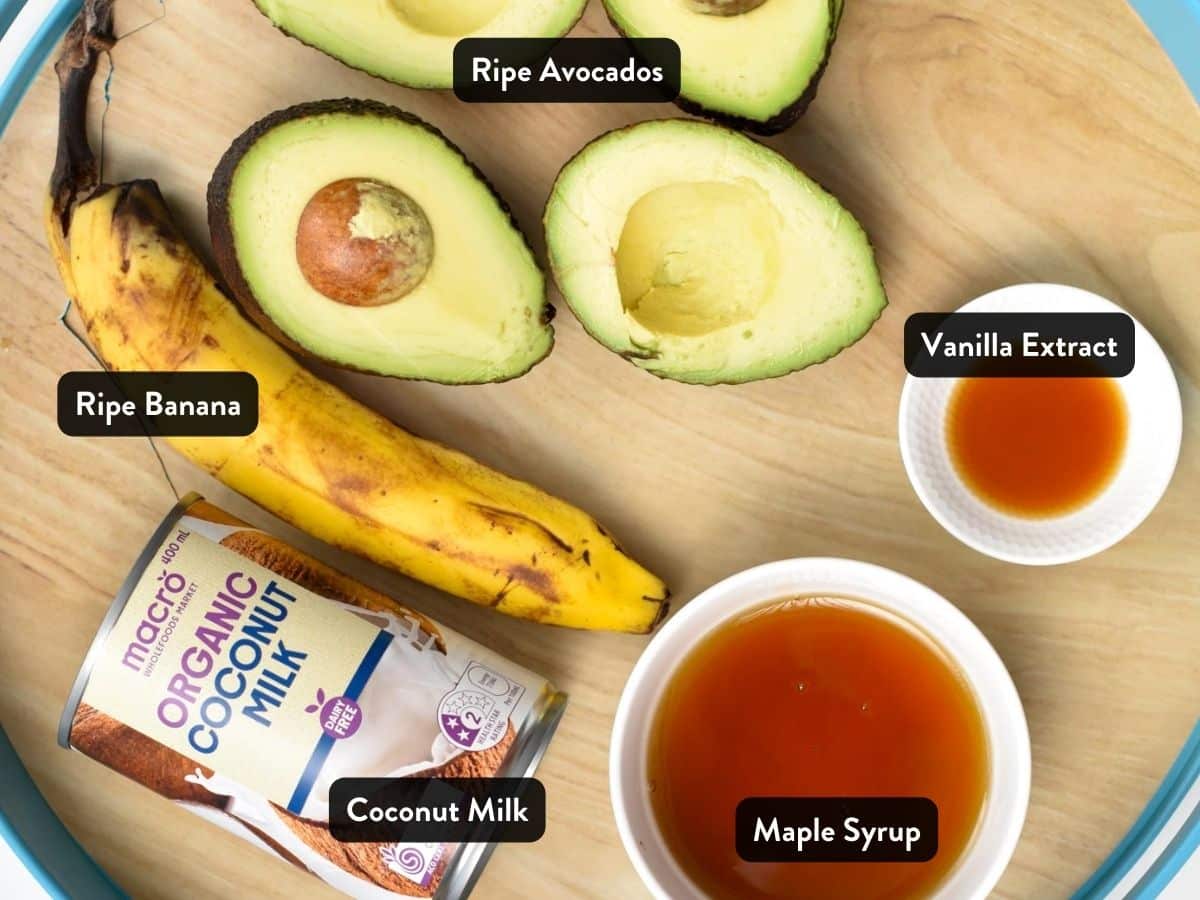 Ingredients for Avocado Popsicles in various bowls and ramekins on a large tray.