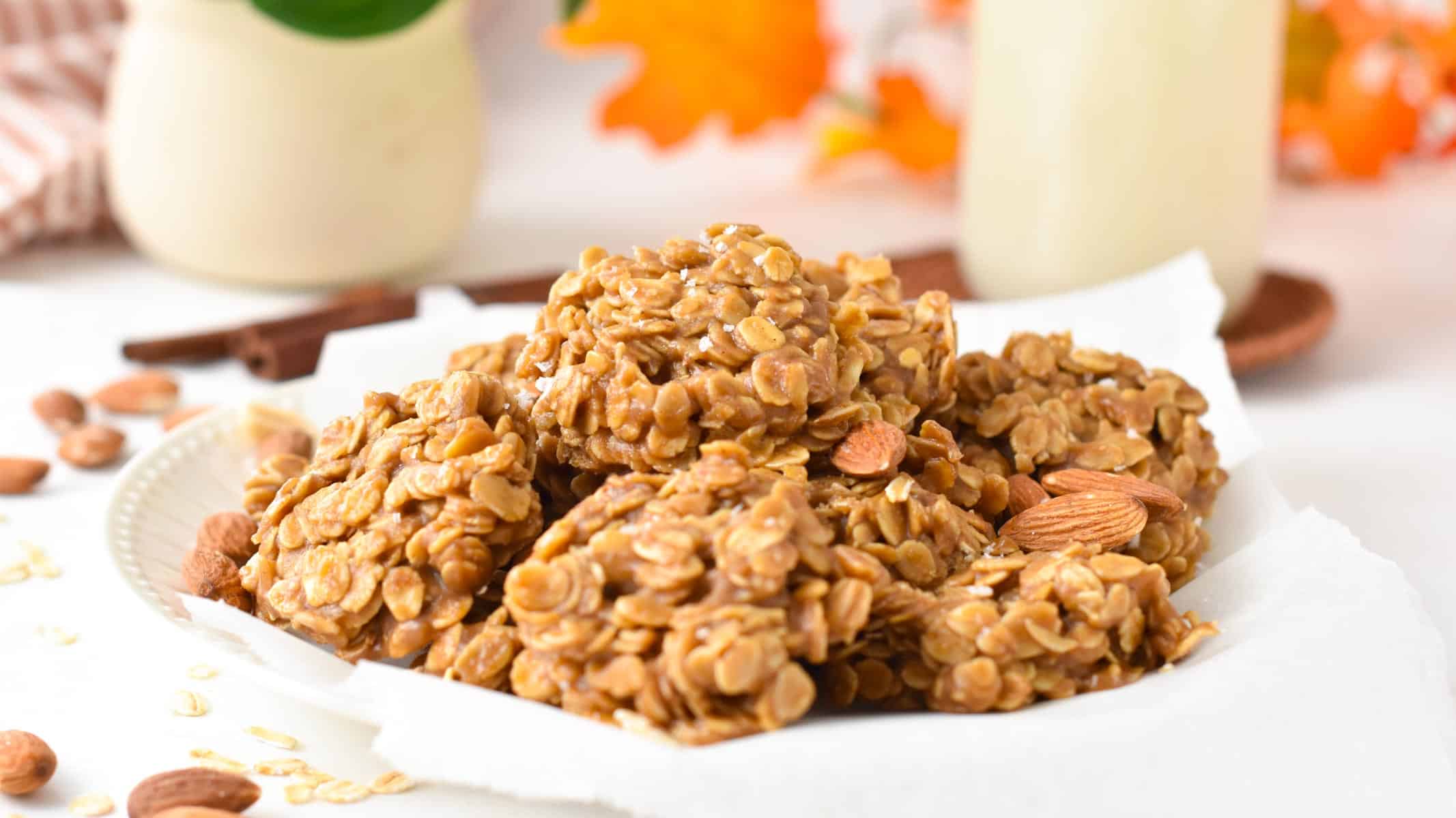 a plate filled with a stack of no-bake almond butter cookies