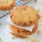 Vegan Peanut Butter Oatmeal Cookies stacked on a white table.