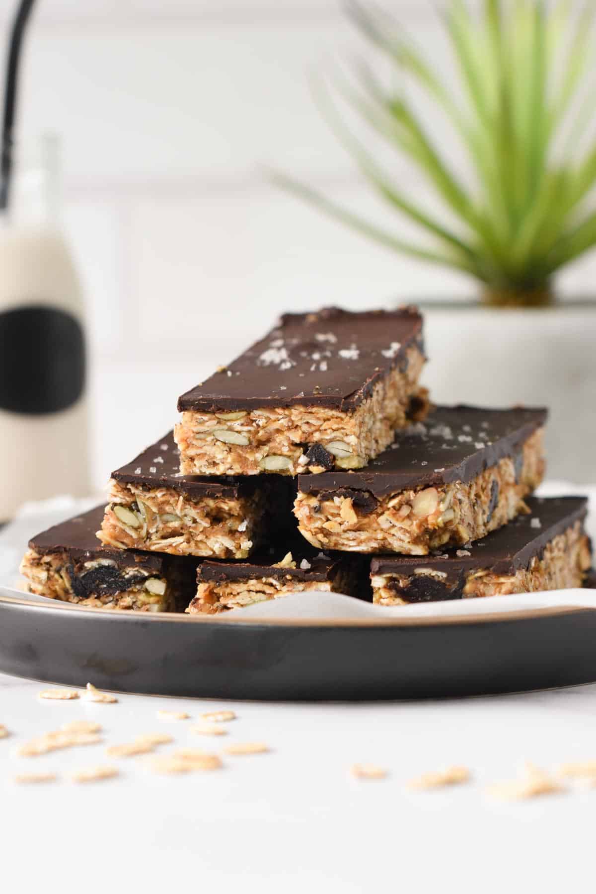 No Bake Granola Bar recipe stacked on a black plate.