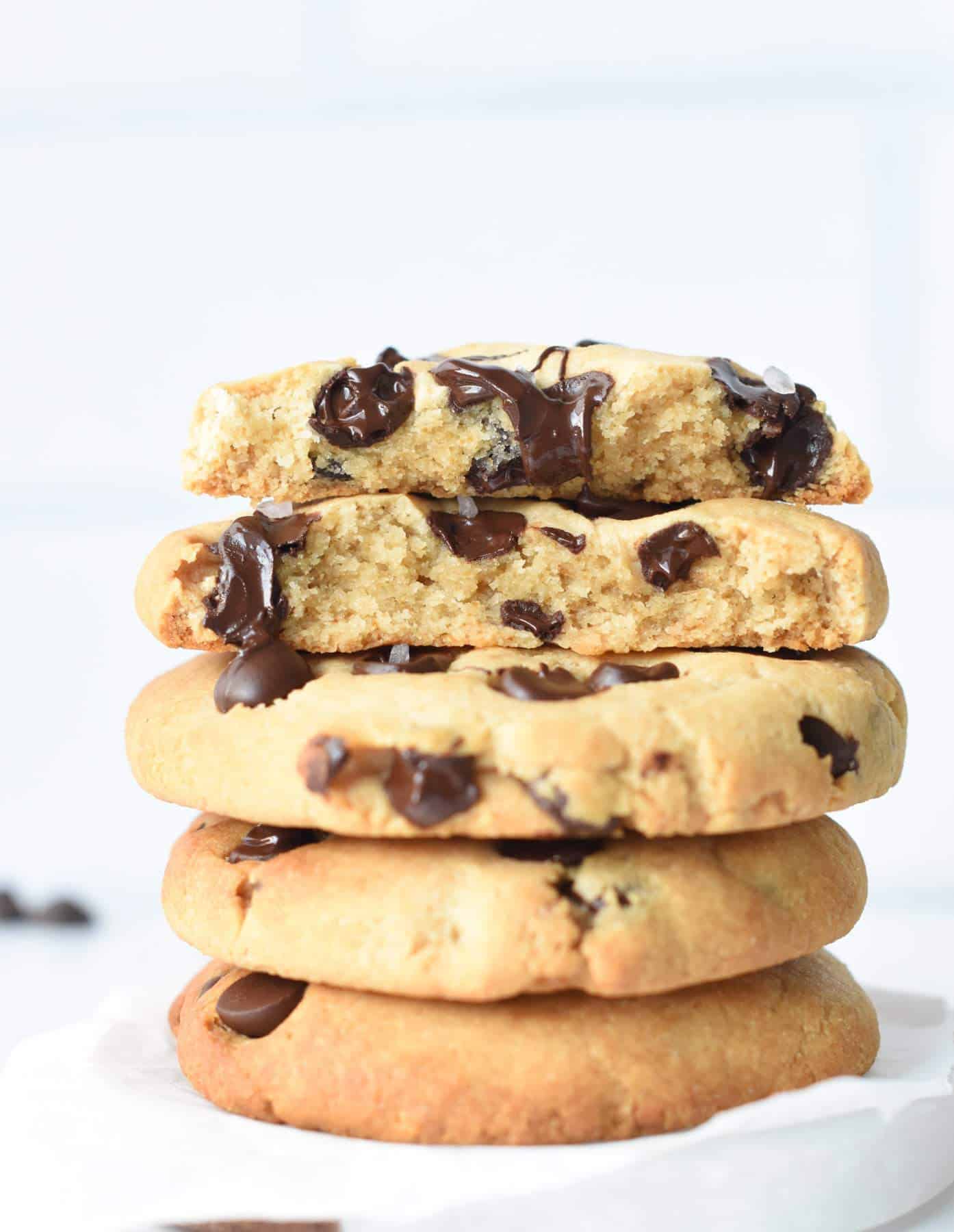 Tahini Chocolate Chips Cookies stacked on a table. 