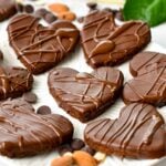 Heart shaped almond flour shortbread cookies covered with melted dark chocolate