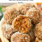 a ball filled with a stack of no-bake carrot cake energy bites made with dates, nuts, and carrots