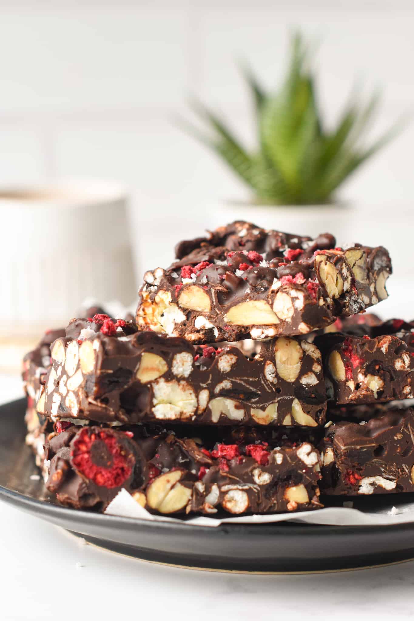 Healthy Rocky Road Bars stacked on a black plate.