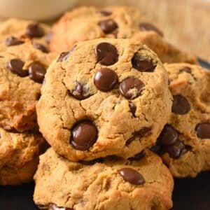 a plate filled with chickpea peanut butter cookies with chocolate chips