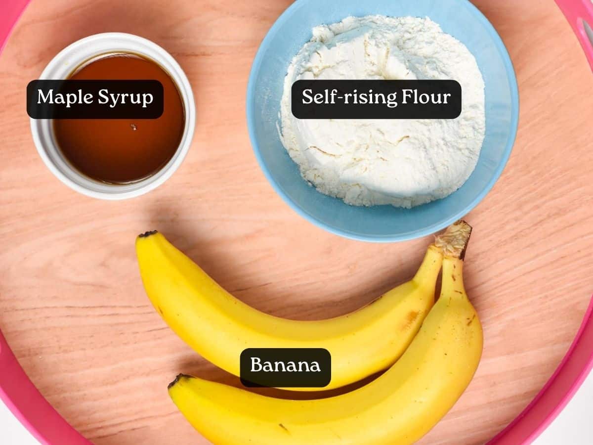 Ingredients for Banana Cookies: 2 bananas, a bowl with self-rising flour, and a bowl with maple syrup