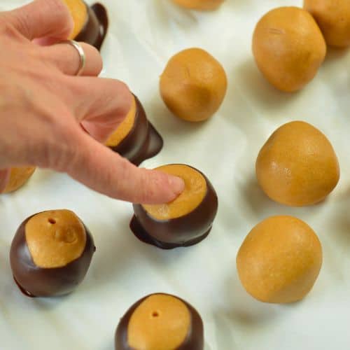 Pressing the Vegan Buckeyes with my finger.