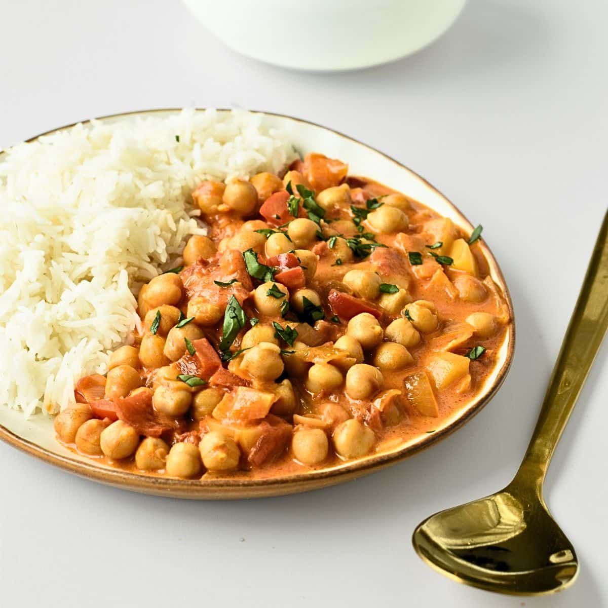 Vegan Chickpea Curry on a plate with rice.