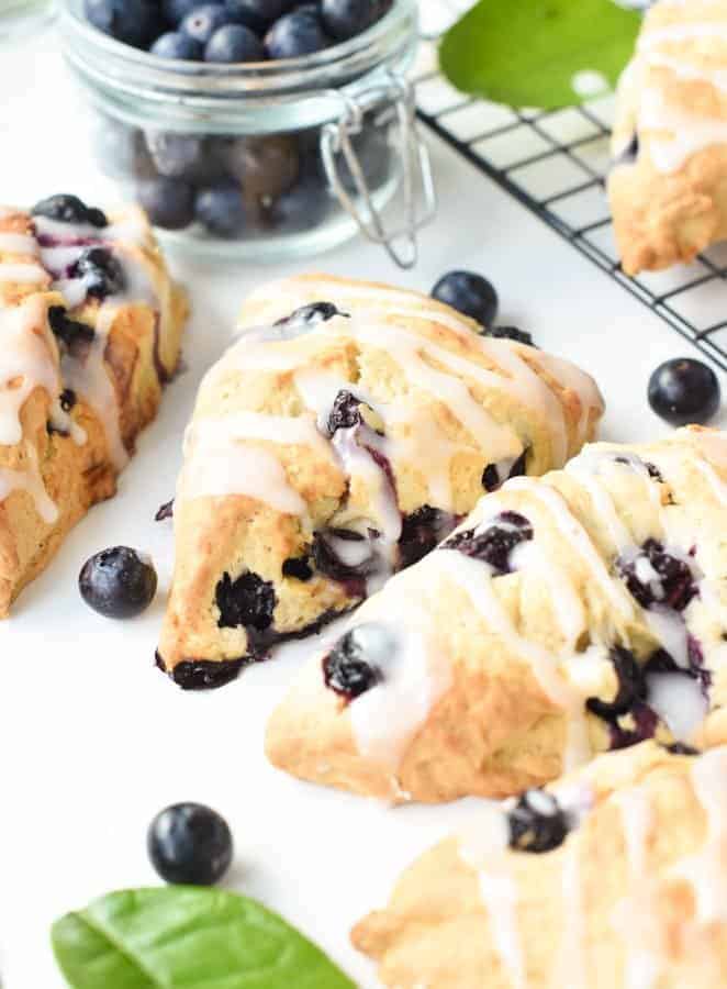 Vegan blueberry lemon scones decorated with glazing.