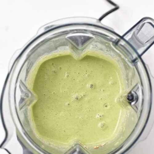 blender jug with a green pancake batter