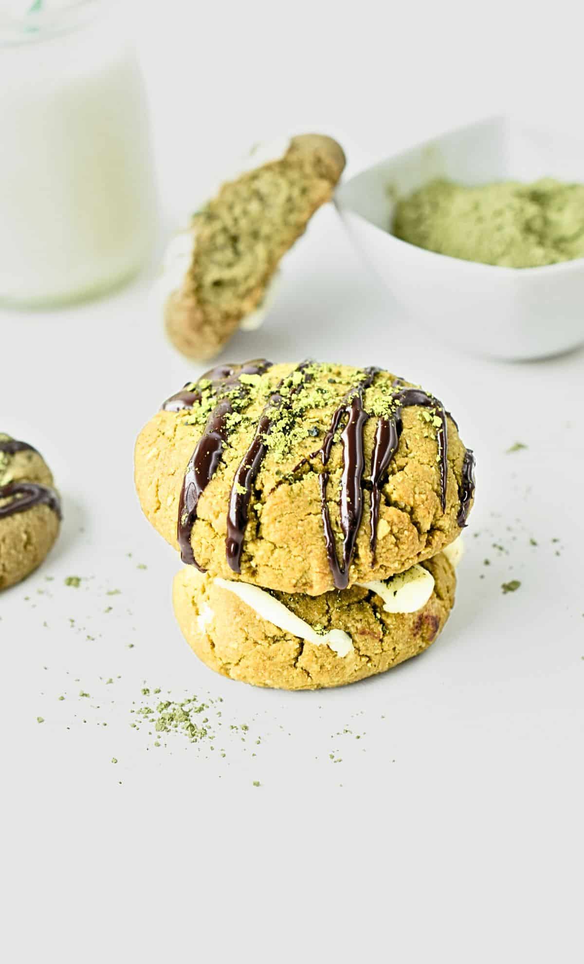 Almond Flour Matcha Cookies stacked on a table.