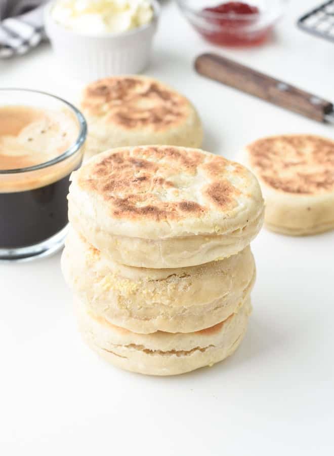 English muffin recipe stacked next to a coffee cup.