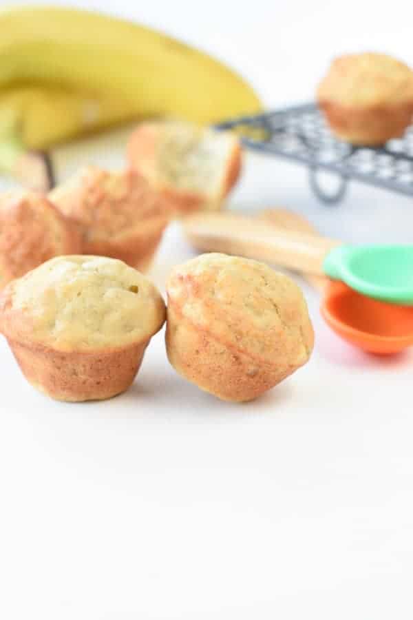 baby-friendly banana muffins in front of a cooling rack.