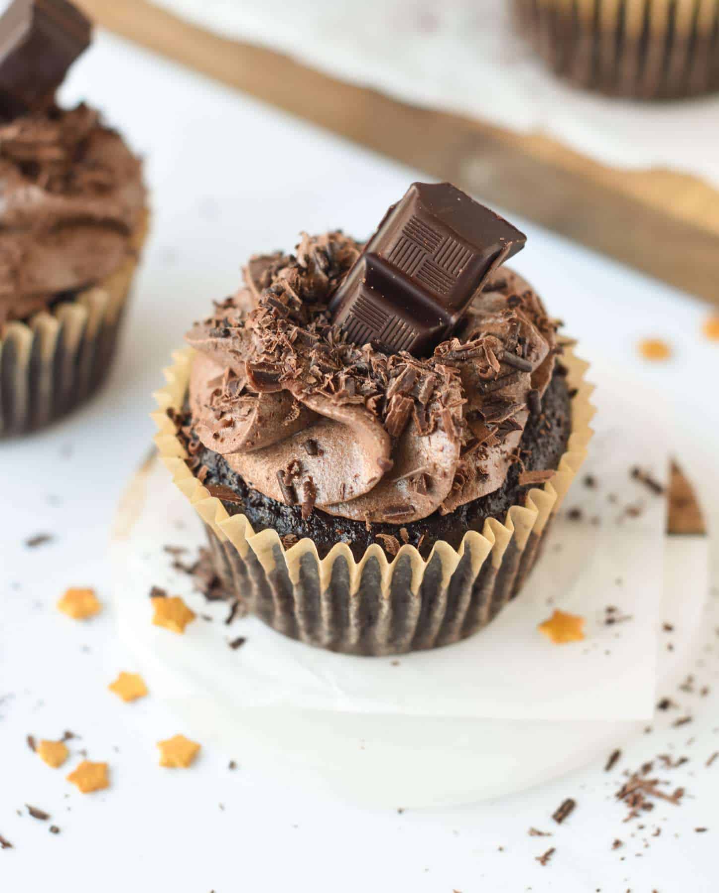 Vegan Chocolate Cupcakes decorated with chocolate chunks.