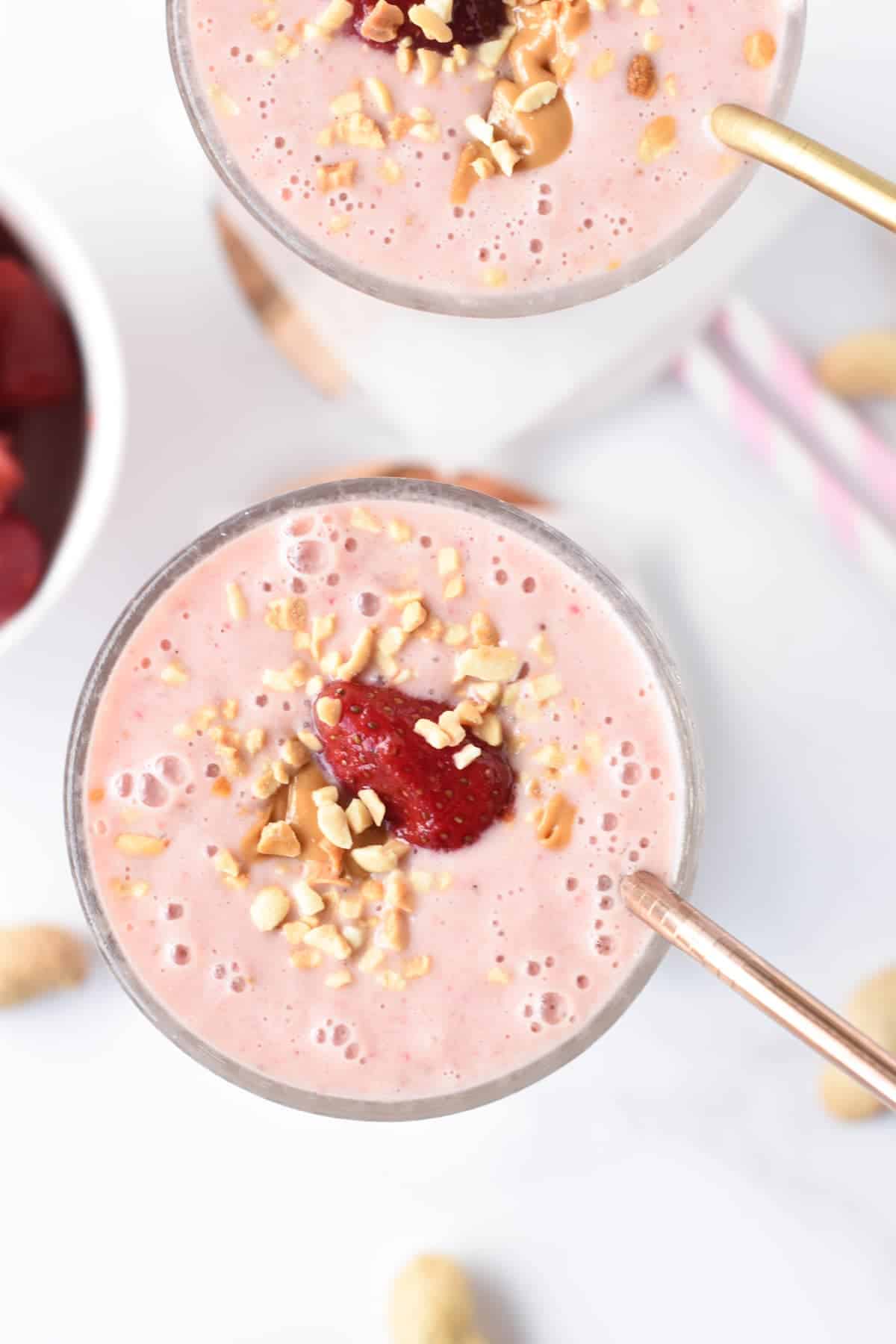 Strawberry Almond Milk Smoothie in two tall glasses.