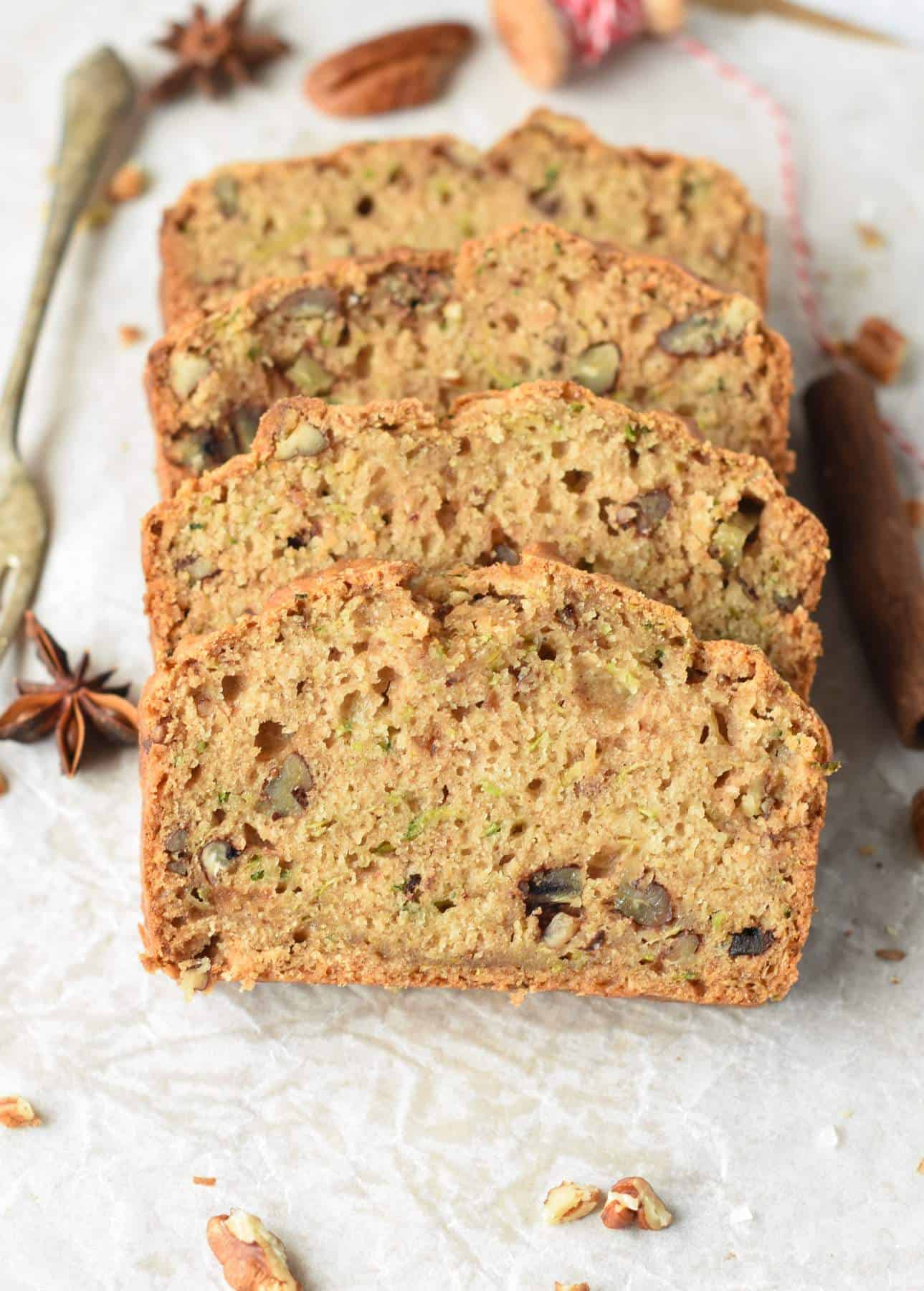 Vegan Zucchini Bread slices next to a golden fork.