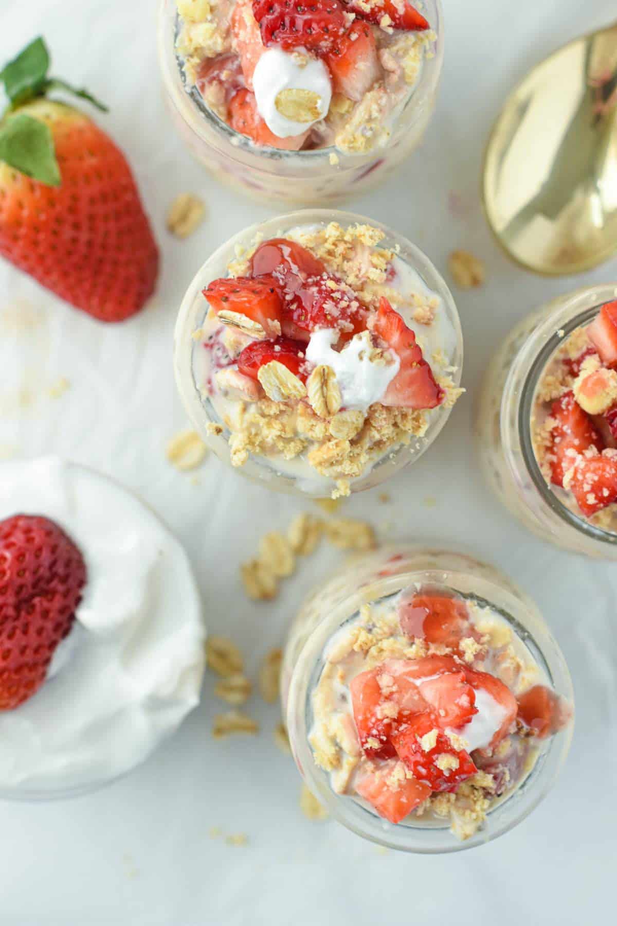 Easy Healthy Overnight Oats with a strawberry cheesecake topping.