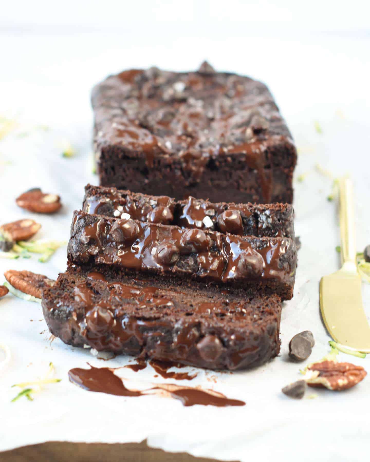 Healthy Vegan Chocolate Zucchini Bread sliced on a board.