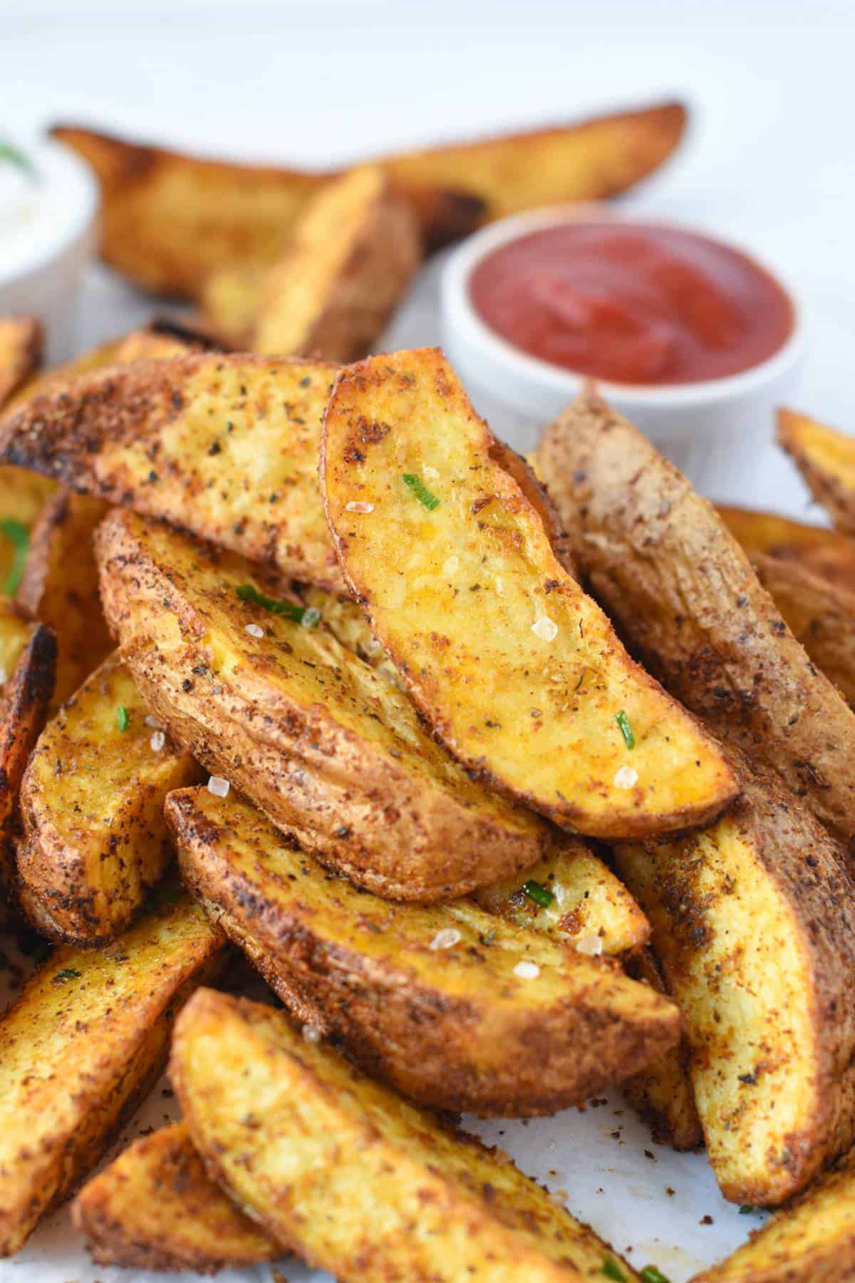 Air Fryer Potato Wedges recipe seasoned with salt and herbs.