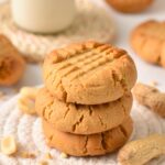 a stack of 3 Almond Flour Peanut Butter Cookies with a crisscross pattern on top