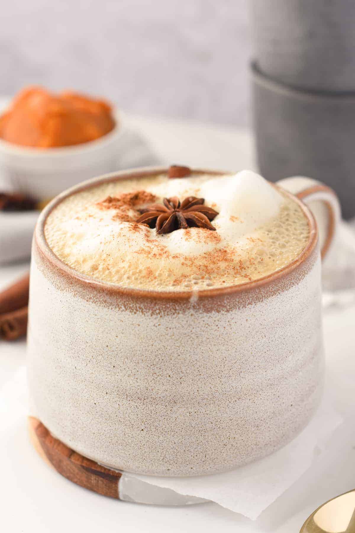 Chai Spice Latte in a large cup decorated with star anise.