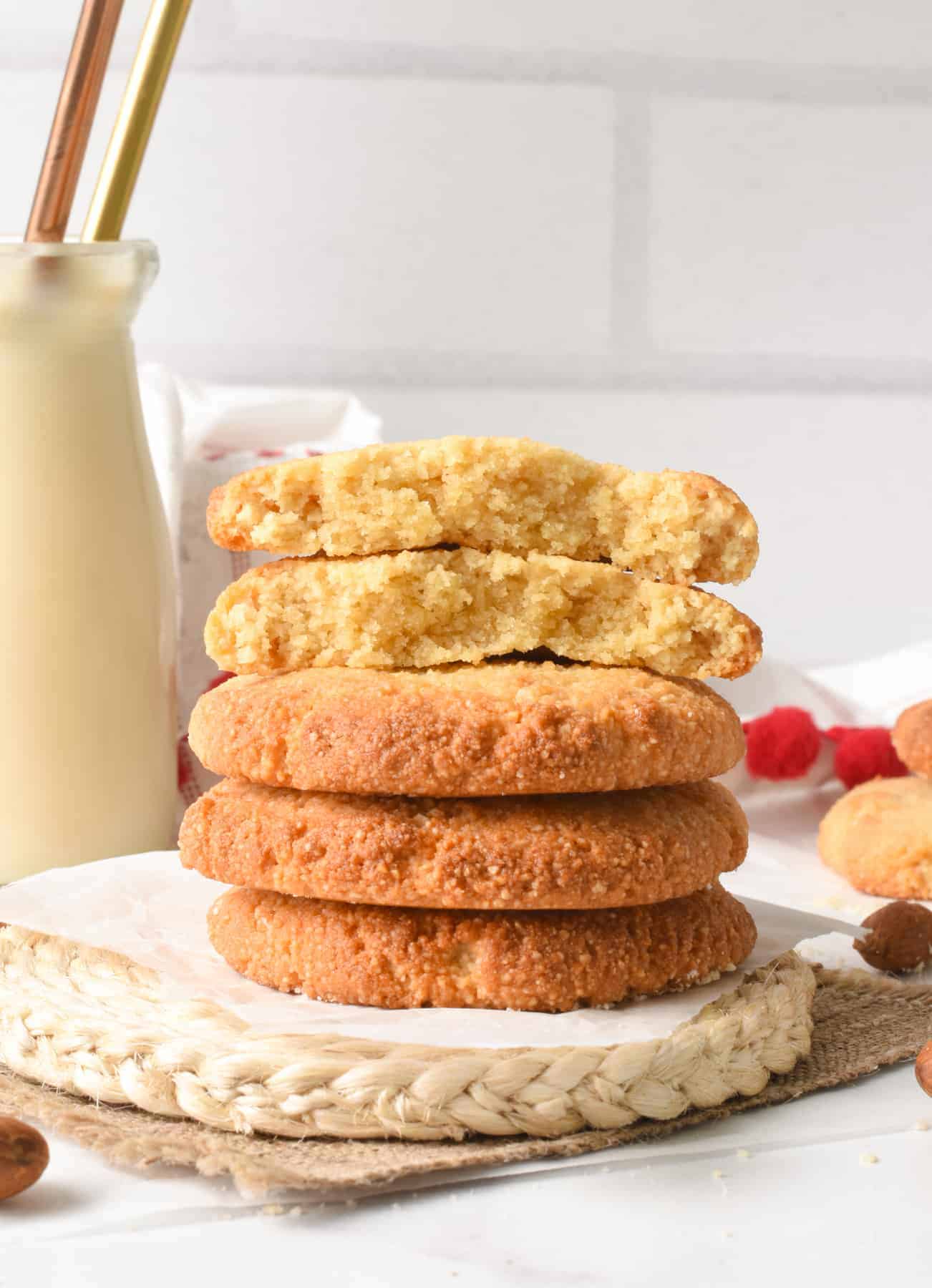 2 ingredient Cookies stacked on a coaster with the top one cut in half