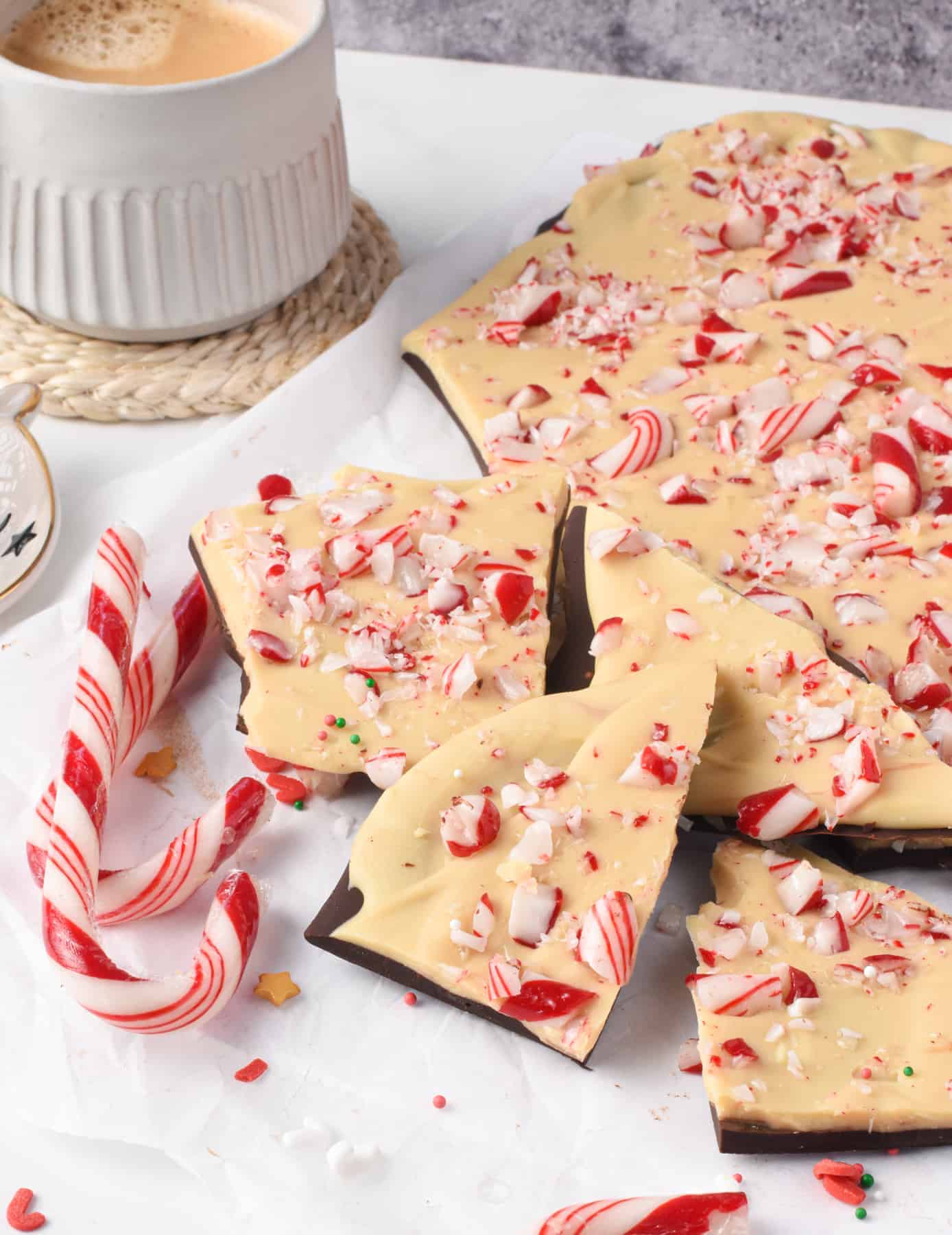 Dark Chocolate Peppermint Bark next to a cup of coffee.