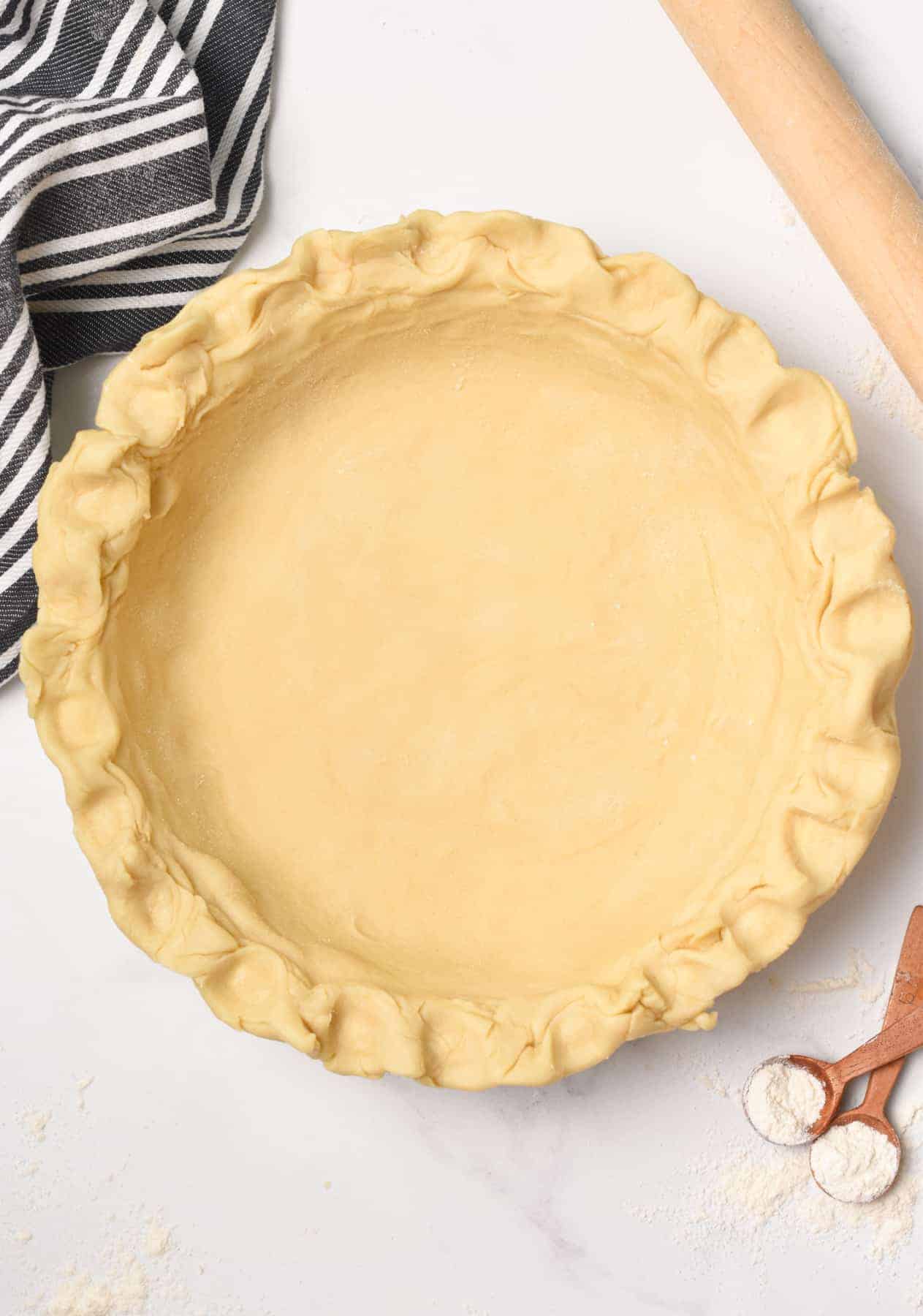 Vegan Pie Crust prebaked in a pie pan.