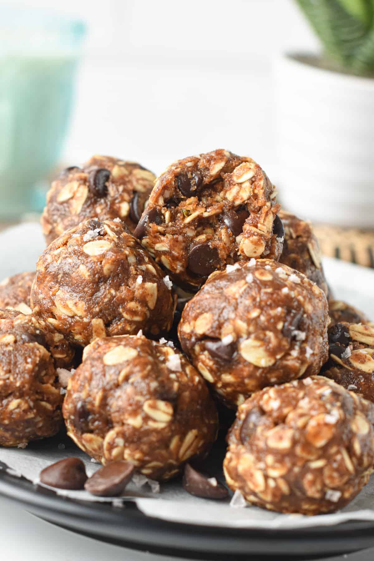 Almond Butter Energy Balls stacked on a plate.