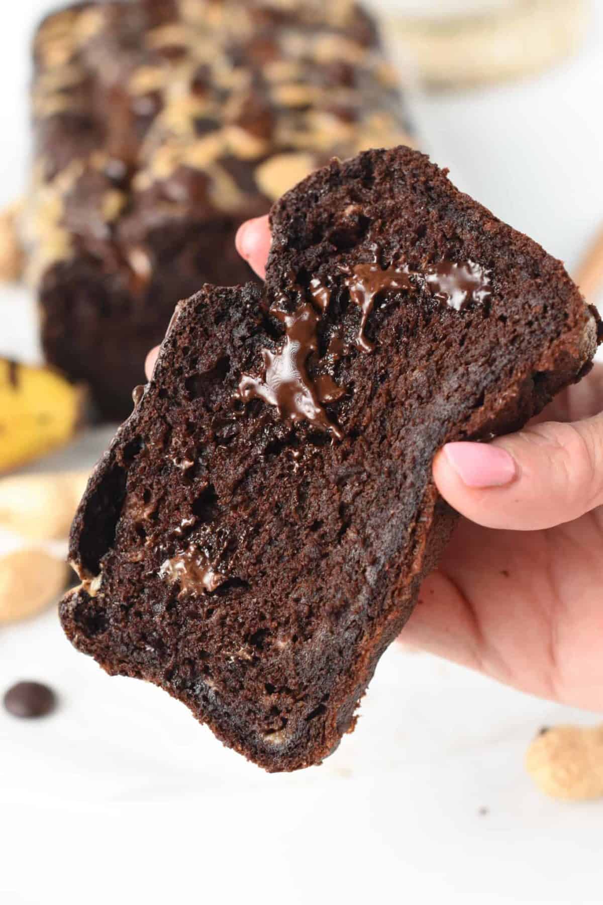 Slice of Chocolate Peanut Butter Banana Bread showing the soft and chocolatey crumbs.