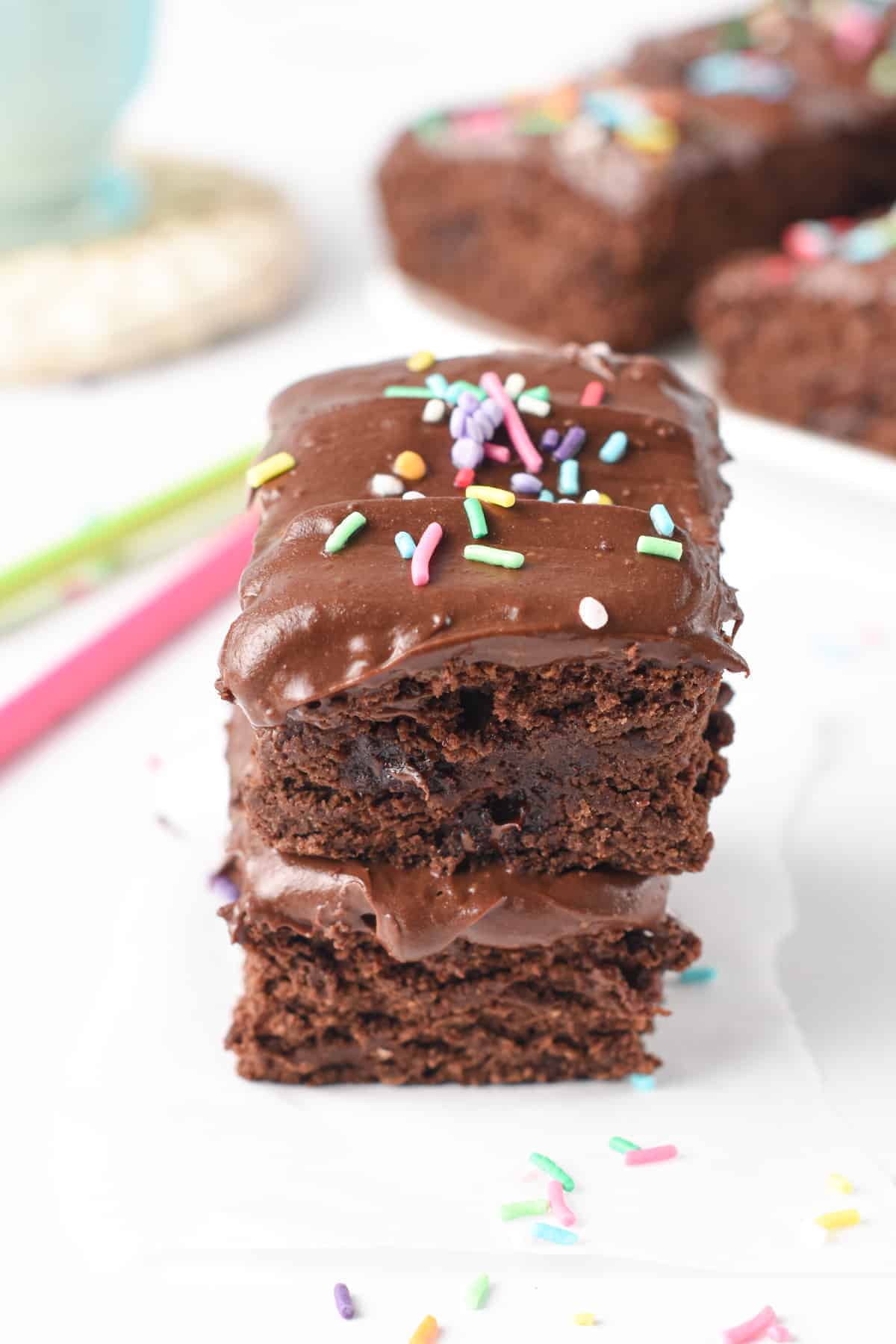 Protein Powder Brownies stacked and decorated with sprinkles.
