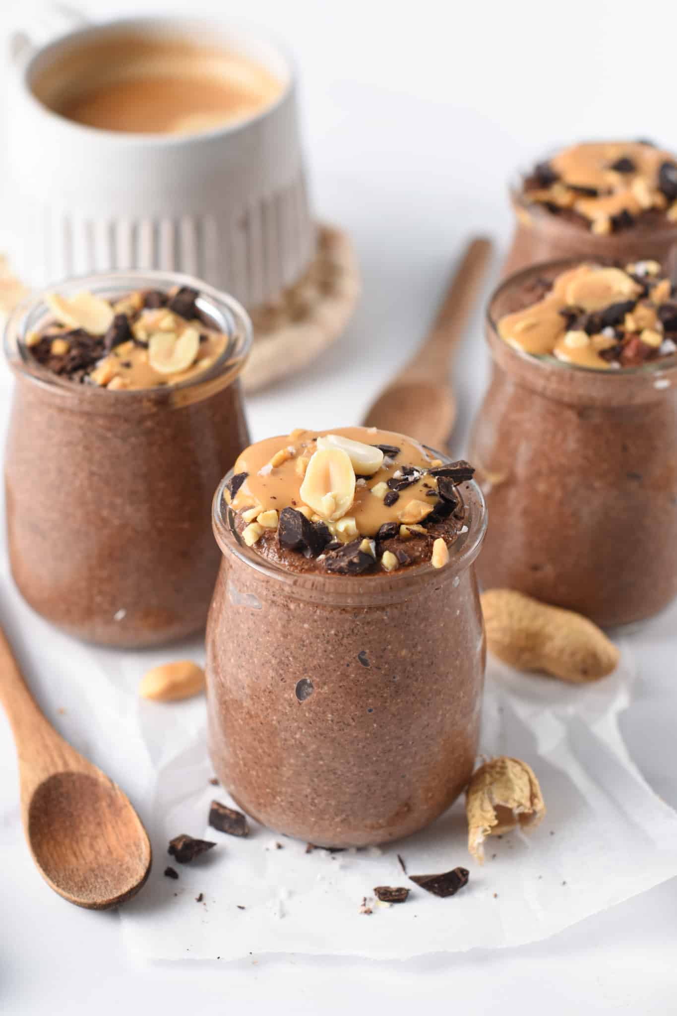 Chocolate Chia Pudding in 3 small jars.