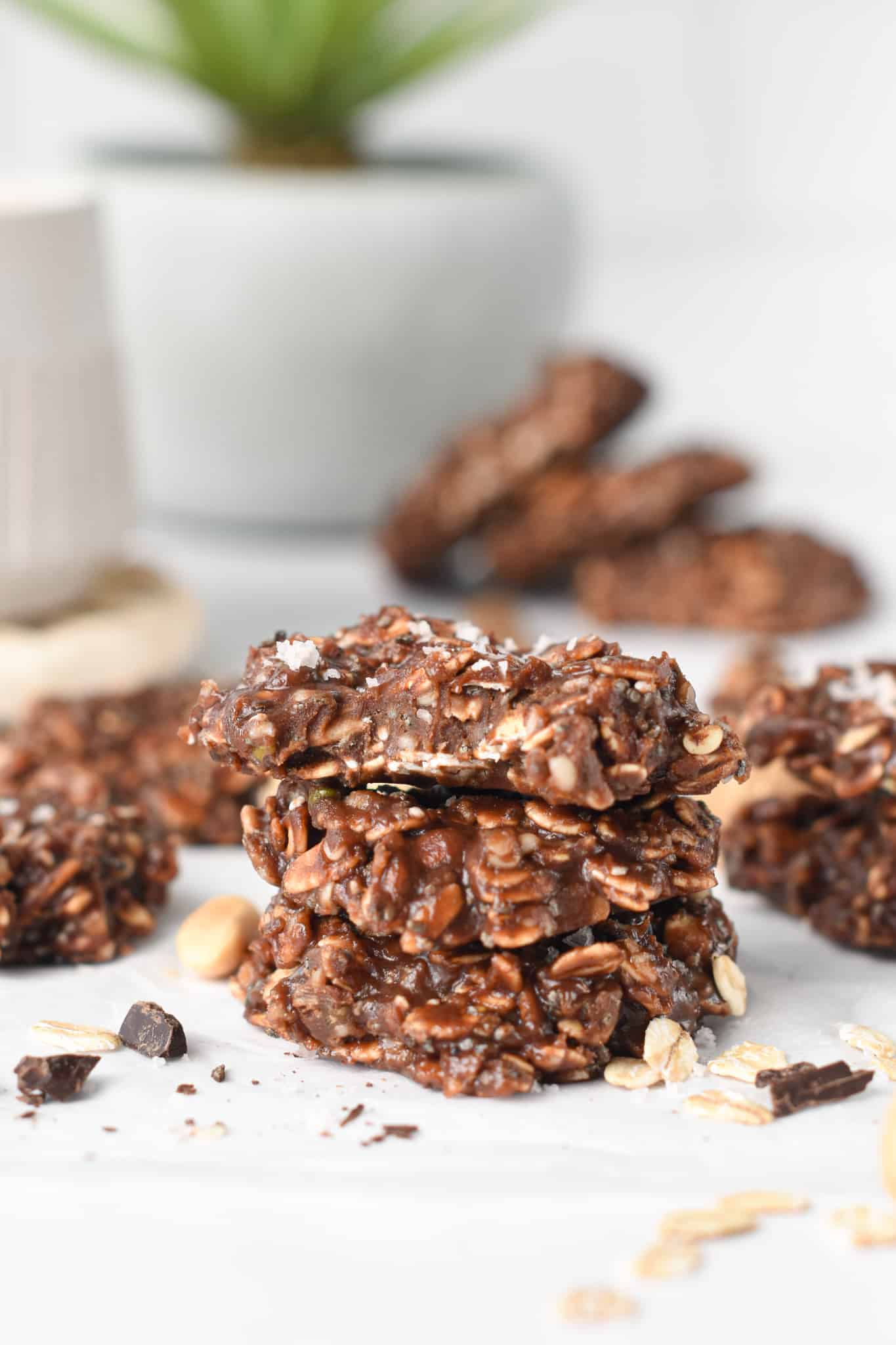 No Bake Protein Cookies stacked on a table.