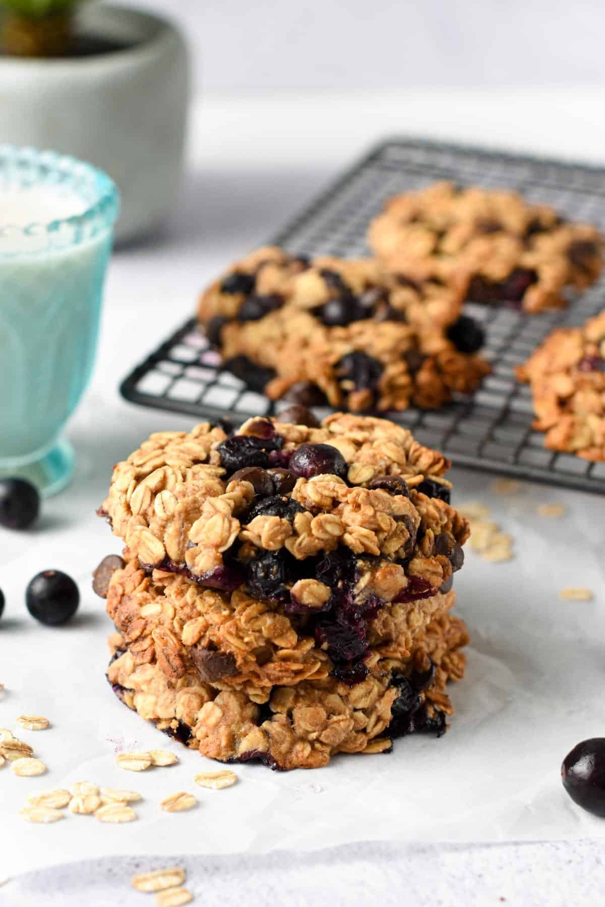 Blueberry Oatmeal Cookies stacked on a table.