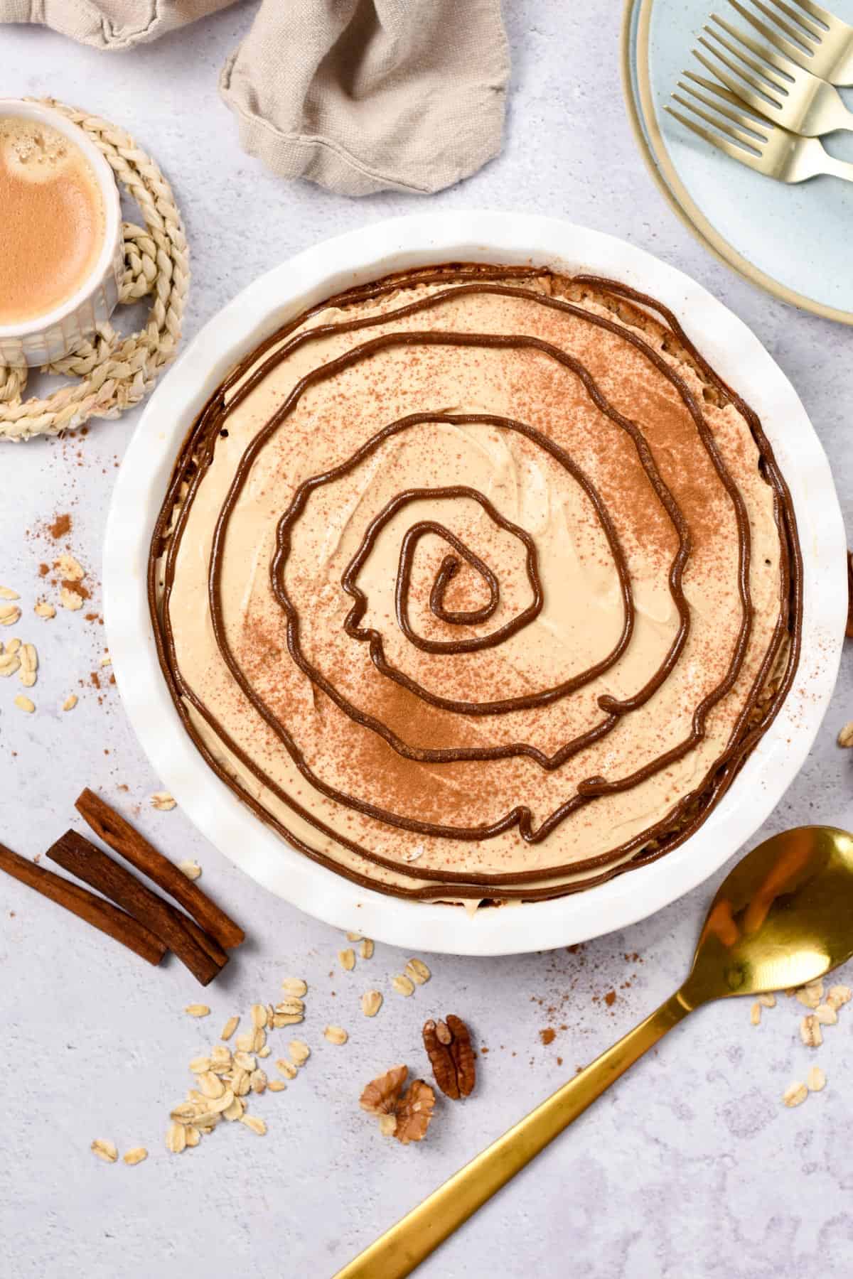 Cinnamon Roll Baked Oatmeal in a large white baking dish.