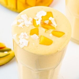 This creamy refreshing Mango Protein Smoothie recipe is the perfect post-workout high-protein smoothie packed with 25 grams of protein.