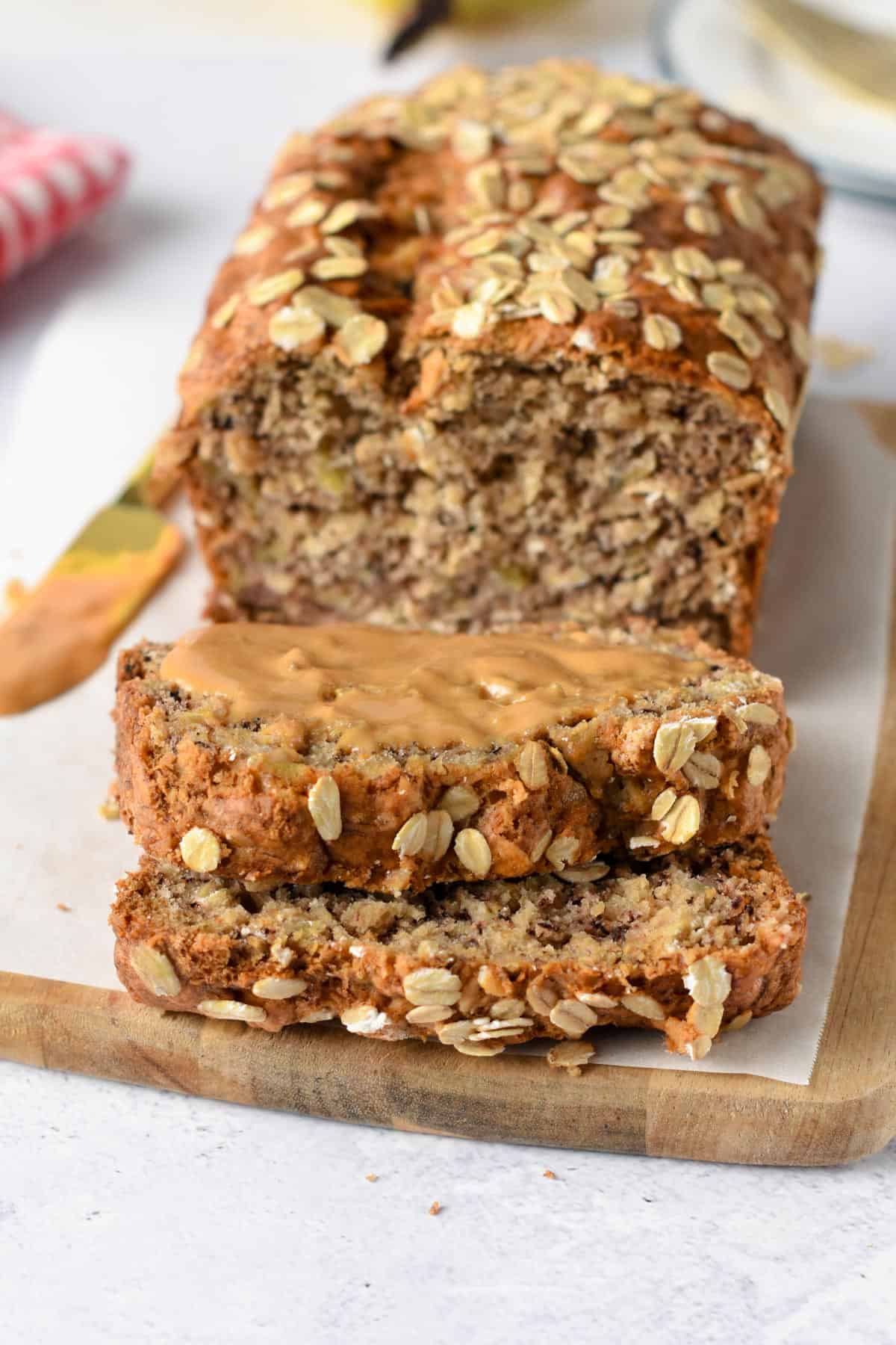 Banana Oatmeal Bread sliced on a chopping board.