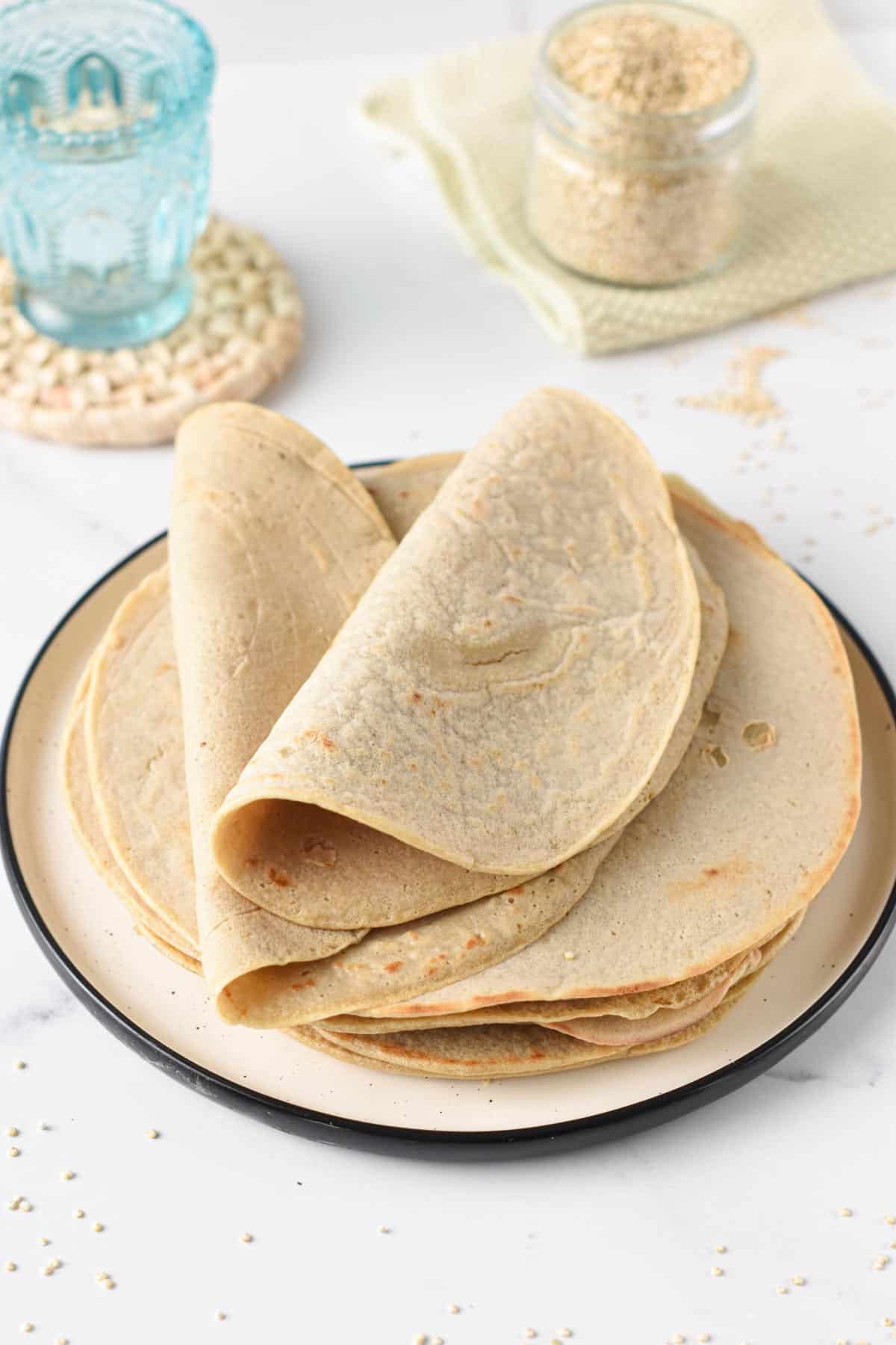 Quinoa Tortillas on a plate with the top two folded in half.