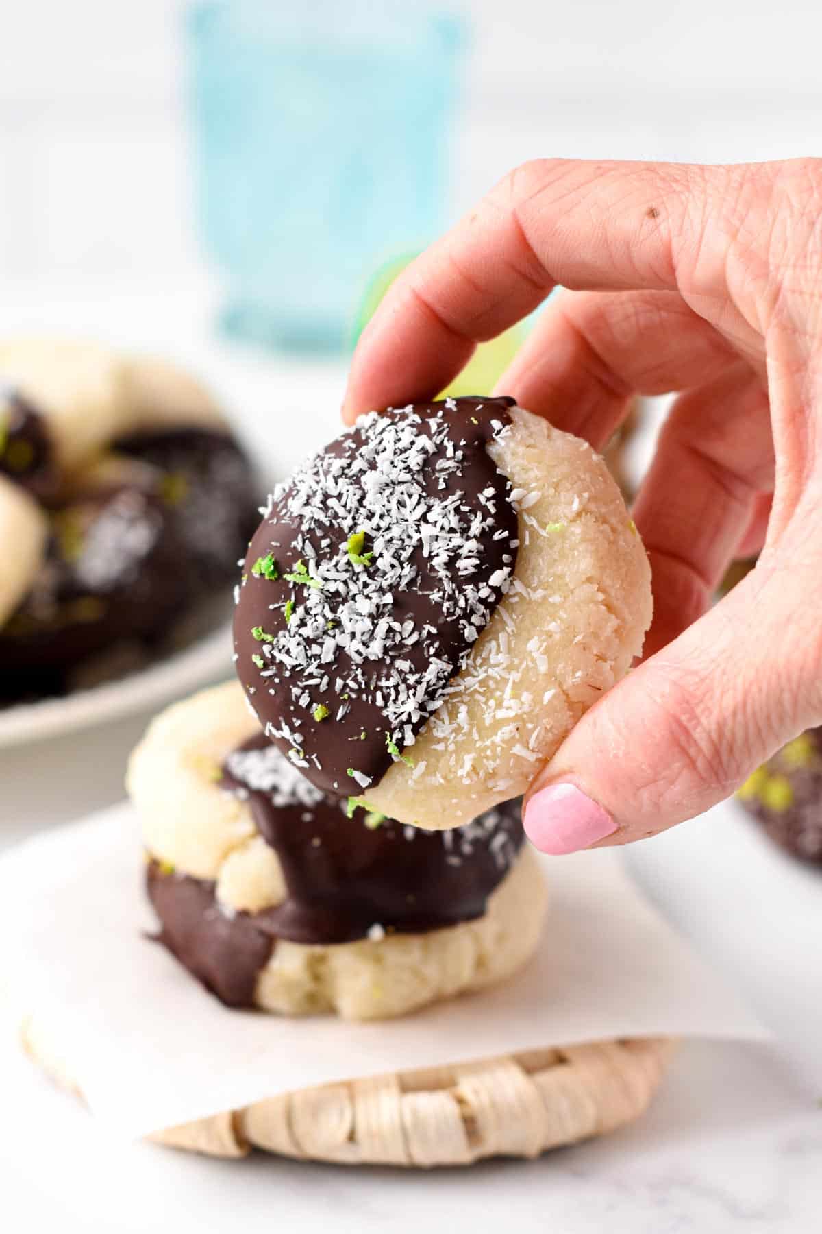 No-Bake Coconut Cookies decorated with shredded coconut and lime zest.