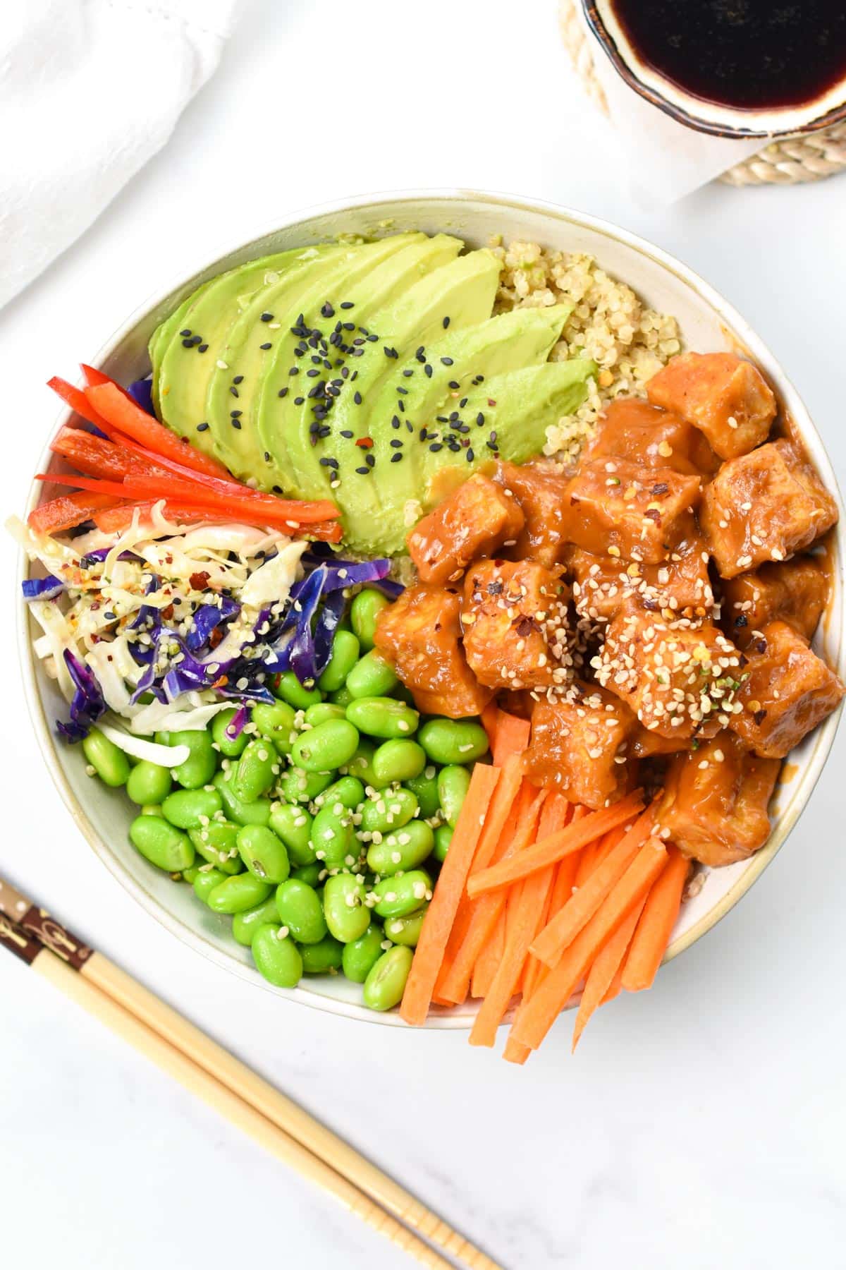 Vegan Protein Bowl with avocado, edamame, tofu, and many vegetables.