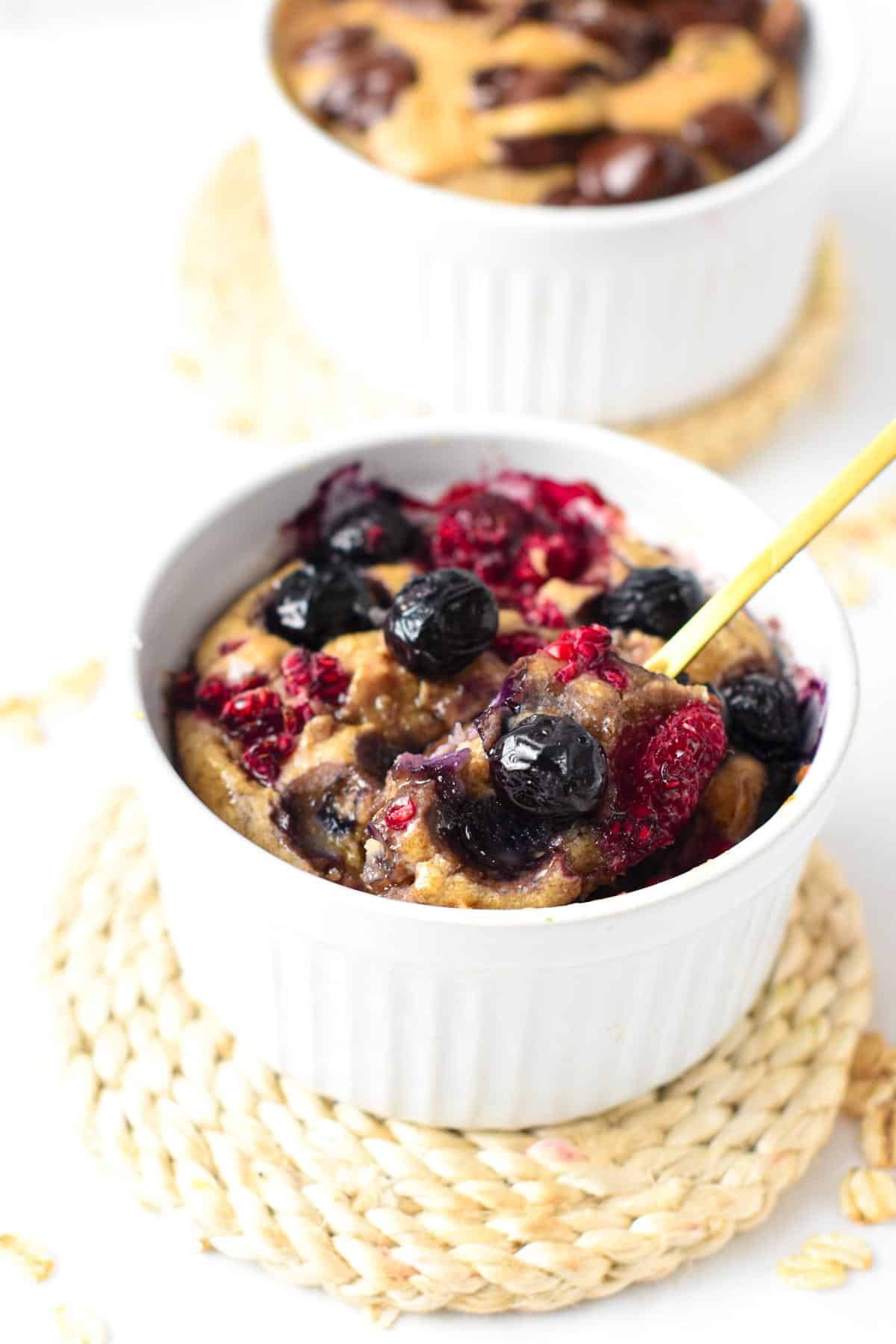 Vegan Baked Oats with a golden spoon.