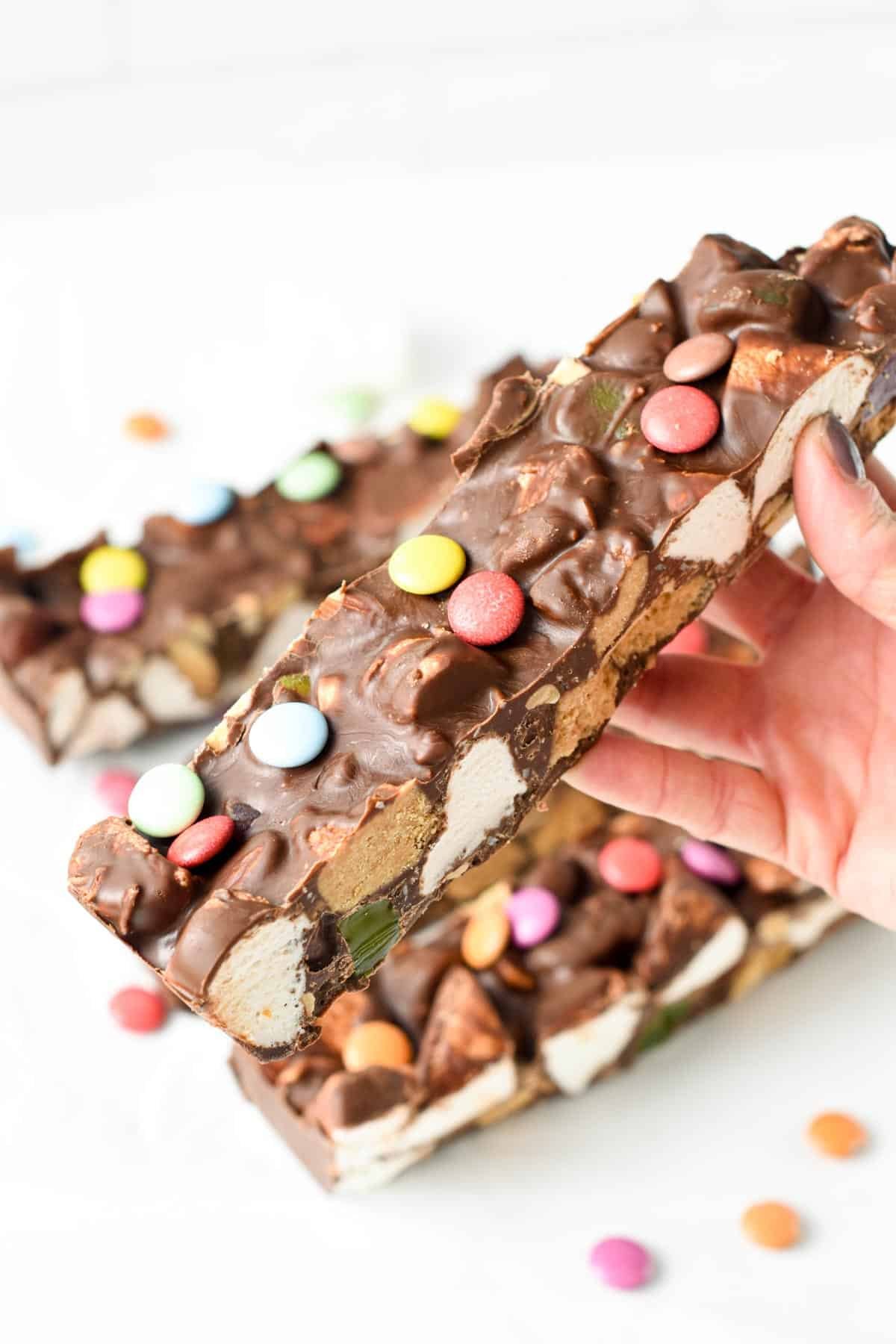 Holding a bar of Vegan Rocky Road