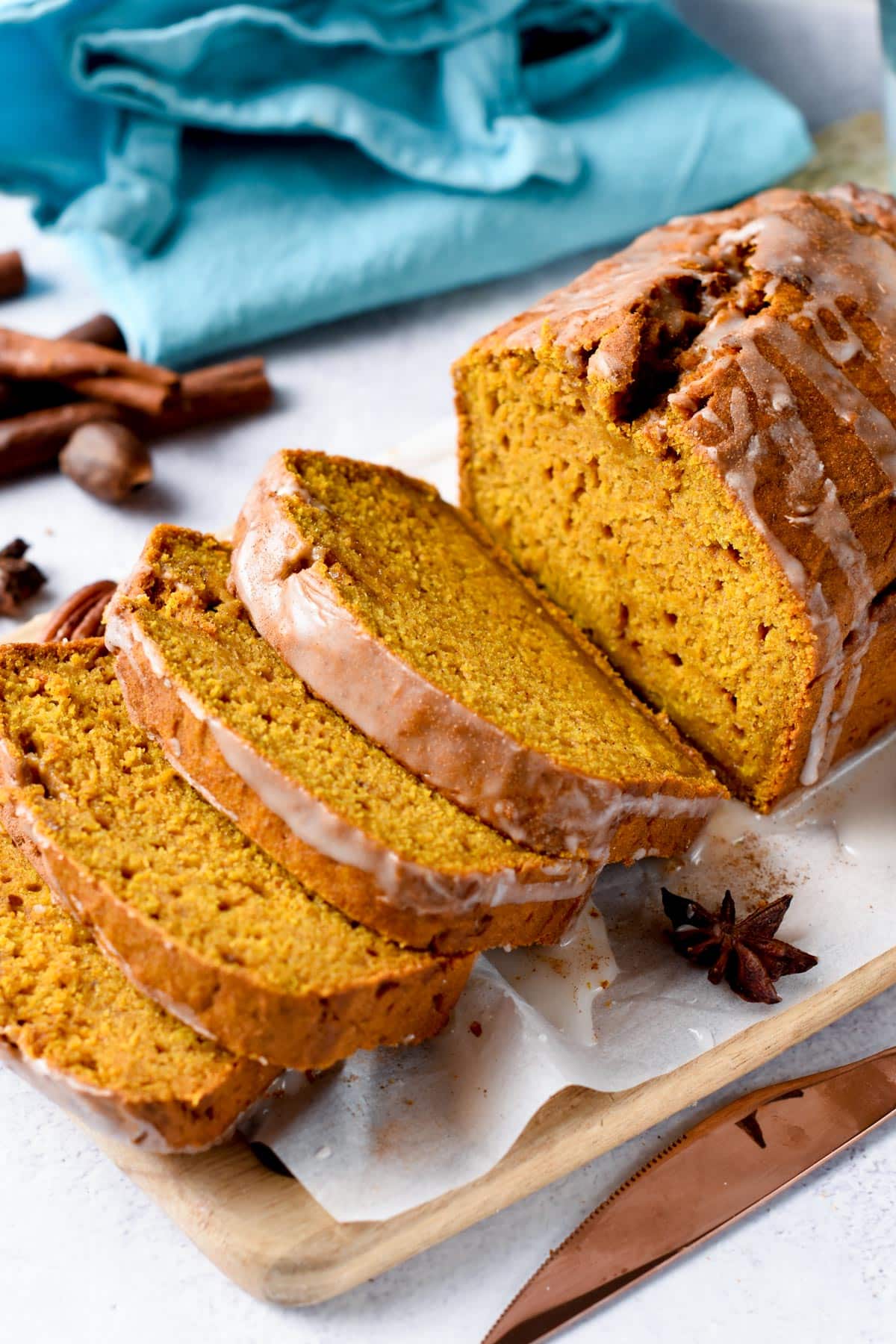 Vegan Pumpkin Bread sliced on a chopping board.