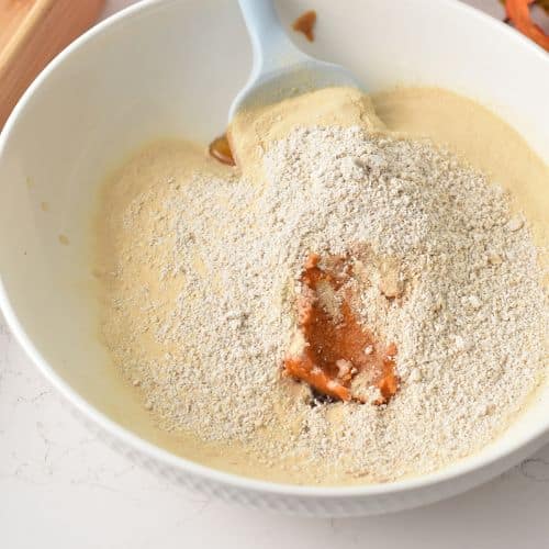 Mixing Pumpkin Protein Bar ingredients in a bowl