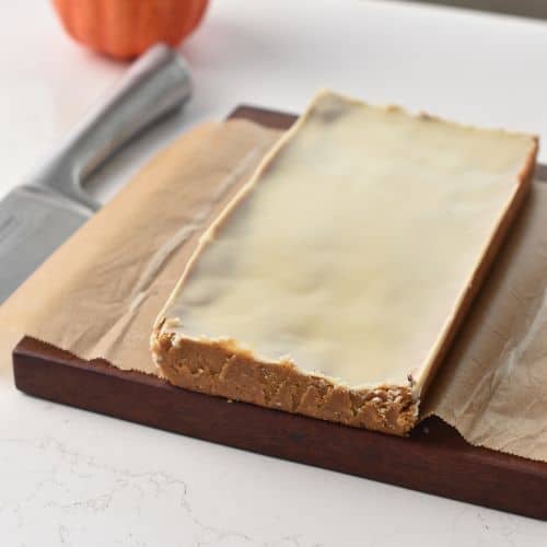 Pumpkin Protein Bars on a board ready to chop.