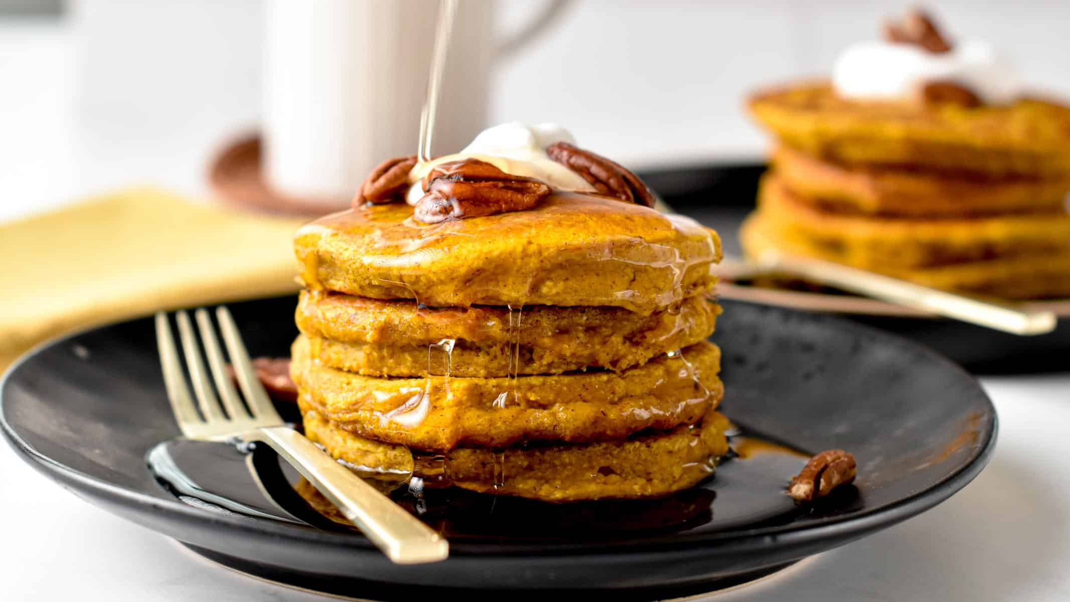 Pumpkin Oatmeal Pancakes served on a plate.