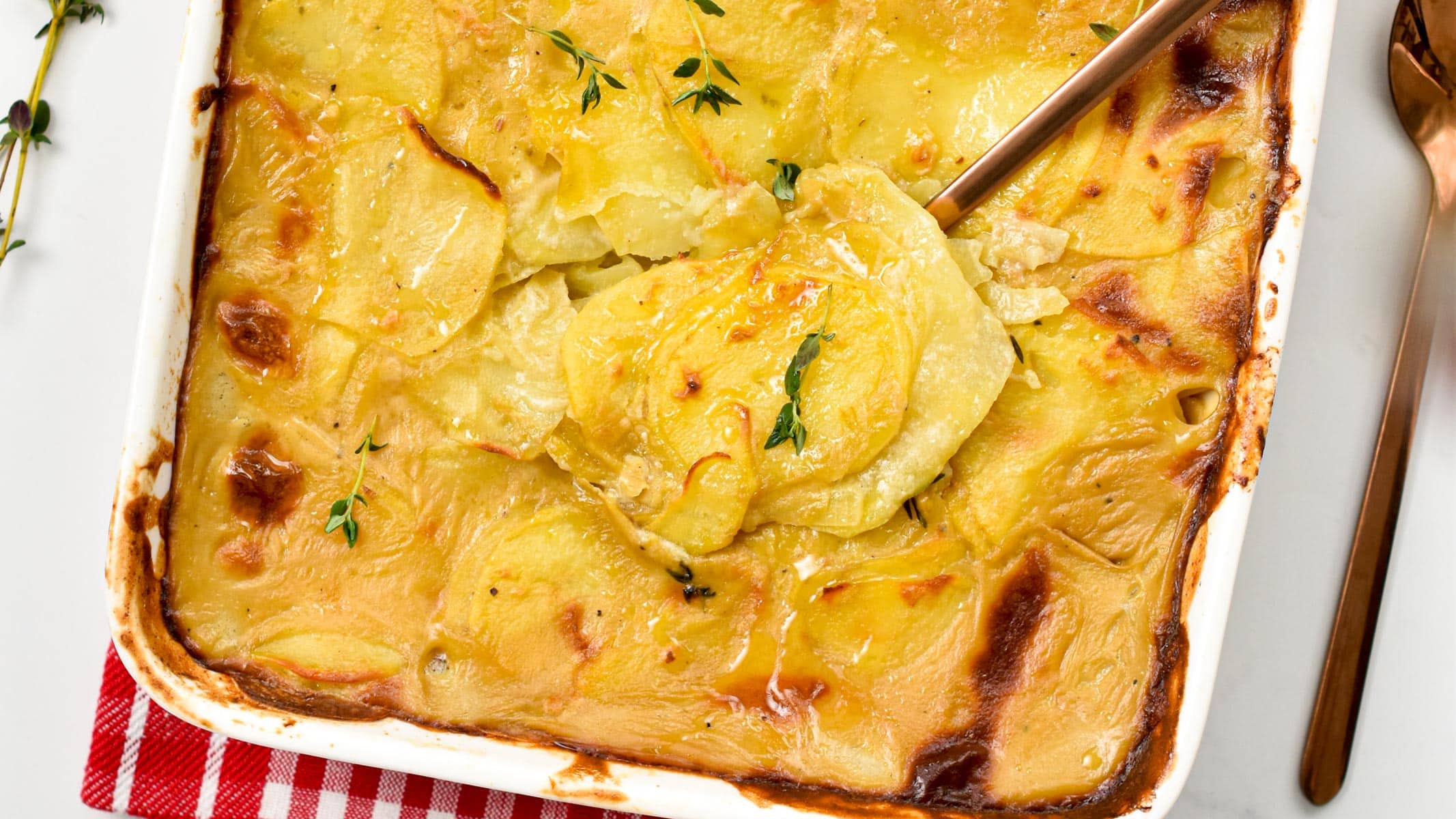 Vegan Scalloped Potatoes in a large ceramic pan.