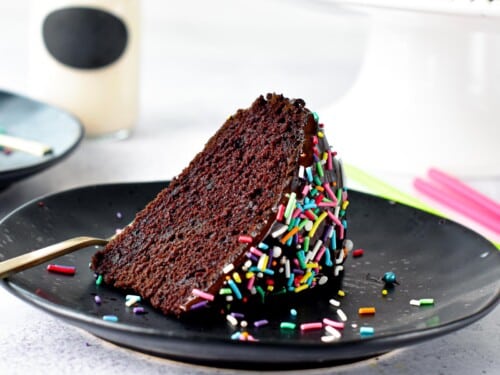 This Eggless Cake recipe is an easy one-bowl egg-free chocolate cake recipe with the most delicious moist cake crumb. Plus, the cake is also dairy-free and vegan approved.