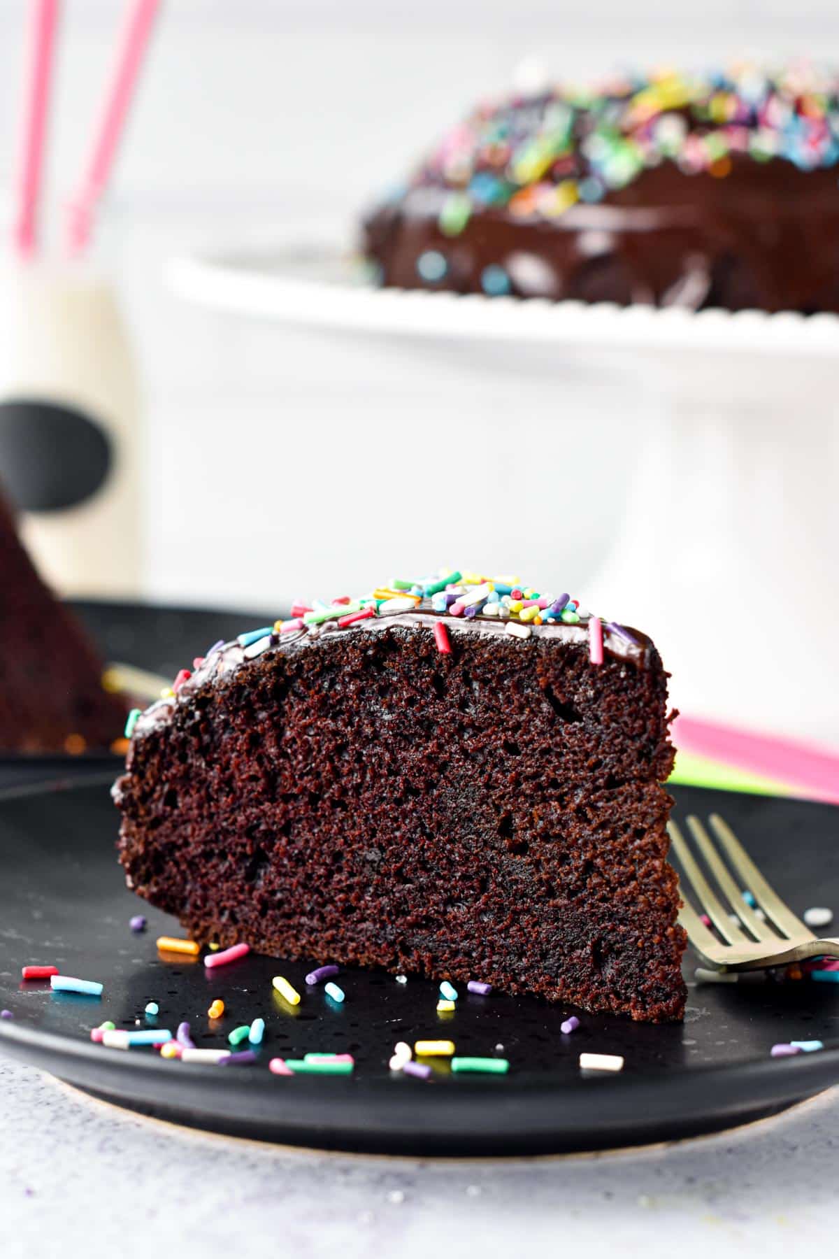 This Eggless Cake recipe is an easy one-bowl egg-free chocolate cake recipe with the most delicious moist cake crumb. Plus, the cake is also dairy-free and vegan approved.