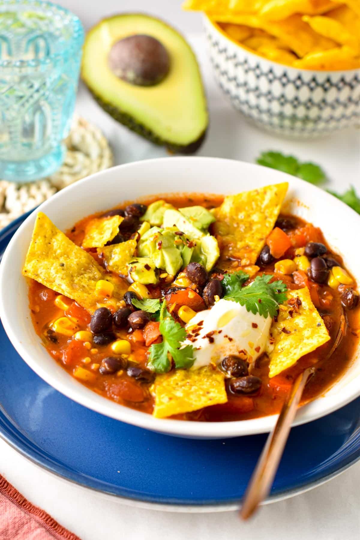 Mexican Soup served in a bowl with tortilla chips.